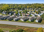 Thumbnail 14 of 15 - A suburban neighborhood with houses and trees.