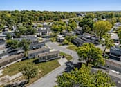 Thumbnail 15 of 15 - A bird's eye view of a residential area with houses and trees.