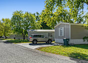 Thumbnail 9 of 15 - A car is parked in front of a house.