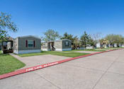 Thumbnail 2 of 4 - A row of houses with a red line in the middle that says Fire Lane - No Parking.