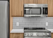 Thumbnail 48 of 109 - Kitchen with black oven at Altaire at Jackson Park, Washington, 98125