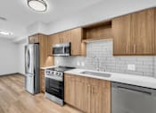 Thumbnail 43 of 109 - Bright Kitchen with wooden cabinets at Altaire at Jackson Park, Seattle, WA, 98125