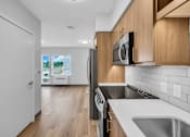 Thumbnail 45 of 109 - Kitchen with appliances at Altaire at Jackson Park, Seattle