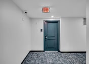 Thumbnail 30 of 109 - Door with exit sign at Altaire at Jackson Park, Seattle, WA