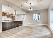 Thumbnail 32 of 41 - A spacious kitchen with wooden floors and a large island
