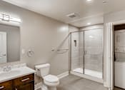 Thumbnail 41 of 41 - A bathroom with a toilet, sink, and shower