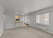 Thumbnail 23 of 41 - A room with a desk and a window