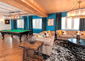 Thumbnail 5 of 41 - A room with couched and a pool table
