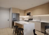Thumbnail 9 of 18 - A modern kitchen with a white island and wooden cabinets.