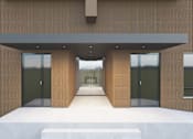 Thumbnail 1 of 18 - A modern building with a white platform in front.