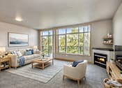 Thumbnail 9 of 14 - A living room with a fireplace and a couch.