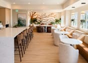 Thumbnail 23 of 30 - A modern dining area with a long table and chairs.