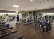Thumbnail 25 of 30 - A gym with people exercising and a sign that says "YGT".