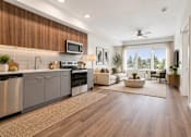 Thumbnail 10 of 51 - A modern kitchen with wooden cabinets and stainless steel appliances.