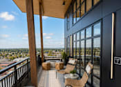 Thumbnail 30 of 30 - A balcony with a view of the cityscape.