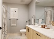 Thumbnail 8 of 51 - A bathroom with a toilet, sink, and a mirror.
