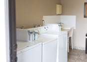 Thumbnail 36 of 38 - A white sink is in a small bathroom.