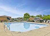 Thumbnail 9 of 15 - A large swimming pool with a depth marker indicating 3 feet.