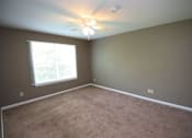 Thumbnail 5 of 18 - A room with a ceiling fan and a window with blinds.