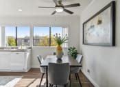 Thumbnail 3 of 35 - a dining room with a table and chairs and a ceiling fan