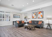 Thumbnail 16 of 38 - a living room with couches and a table