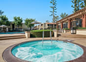 Thumbnail 26 of 35 - a hot tub with a fountain in the middle of a resort style pool