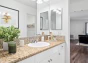 Thumbnail 13 of 29 - a bathroom with sinks and mirrors on the wall