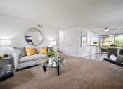 Thumbnail 2 of 57 - our apartments offer a living room with a couch a chair and a coffee table