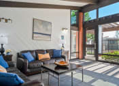 Thumbnail 19 of 35 - a living room with couches and a coffee table