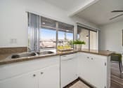 Thumbnail 37 of 57 - a kitchen and dining area in a 555 waverly unit