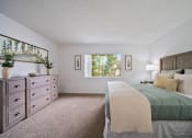 Thumbnail 41 of 57 - a bedroom with a bed and a dresser