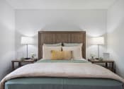 Thumbnail 43 of 57 - a bedroom with a bed and two night stands with lamps