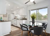 Thumbnail 53 of 57 - a kitchen and dining area in a 555 waverly unit