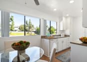 Thumbnail 10 of 41 - an open kitchen and dining room with a view of the yard