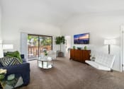 Thumbnail 6 of 41 - a living room with a white couch and a chair