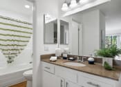 Thumbnail 19 of 41 - a bathroom with a sink and a mirror