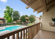 Thumbnail 13 of 24 - a view of a swimming pool from the balcony of a resort condo