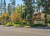 Thumbnail 25 of 41 - a building with a street in front of it and trees