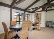 Thumbnail 24 of 24 - a dining room with a wooden table and chairs