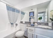 Thumbnail 16 of 68 - a white bathroom with a white toilet and a tub and a sink
