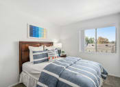 Thumbnail 20 of 68 - a bedroom with a bed and a window