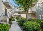 Thumbnail 43 of 68 - a sidewalk in front of an apartment building with stairs