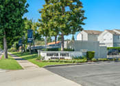 Thumbnail 48 of 68 - the enclave at harrison pointe apartments sign in front of sidewalk and trees
