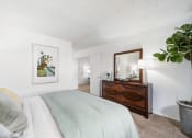 Thumbnail 16 of 32 - our apartments offer a bedroom with a bed and a bathroom