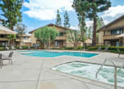 Thumbnail 31 of 32 - our apartments have a swimming pool and a patio with chairs