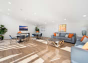 Thumbnail 30 of 34 - a living room with white walls and hardwood flooring