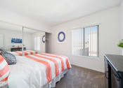 Thumbnail 13 of 34 - a bedroom with two beds and a dresser