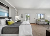 Thumbnail 44 of 61 - a bedroom with a bed and a couch in a 555 waverly unit