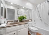 Thumbnail 50 of 61 - a bathroom with a sink and a toilet