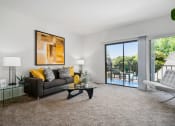 Thumbnail 29 of 61 - our apartments offer a living room with a sofa and a coffee table